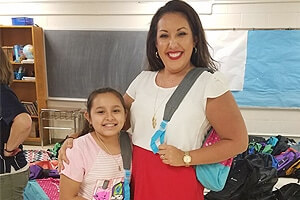 Graves McLain Delivers Free Backpacks to Every Student at Gilcrease Elementary School