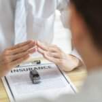 Insurance adjuster reviewing an auto insurance claim in Oklahoma, illustrating how insurance adjusters minimize your claim.