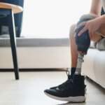 Person with a prosthetic leg exercising after traumatic amputation injuries in Oklahoma, focusing on recovery and rehabilitation.