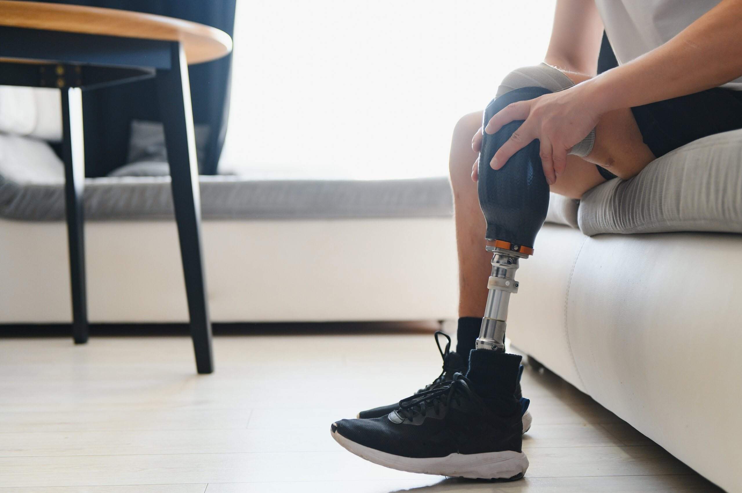 Person with a prosthetic leg exercising after traumatic amputation injuries in Oklahoma, focusing on recovery and rehabilitation.