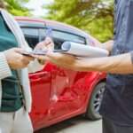 Accident reconstruction experts in injury cases in Tulsa reviewing crash documentation after a vehicle collision.