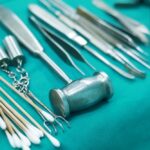 Surgical instruments and swabs laid out on a sterile tray before a procedure" Title: "Retained Surgical Instrument Oklahoma