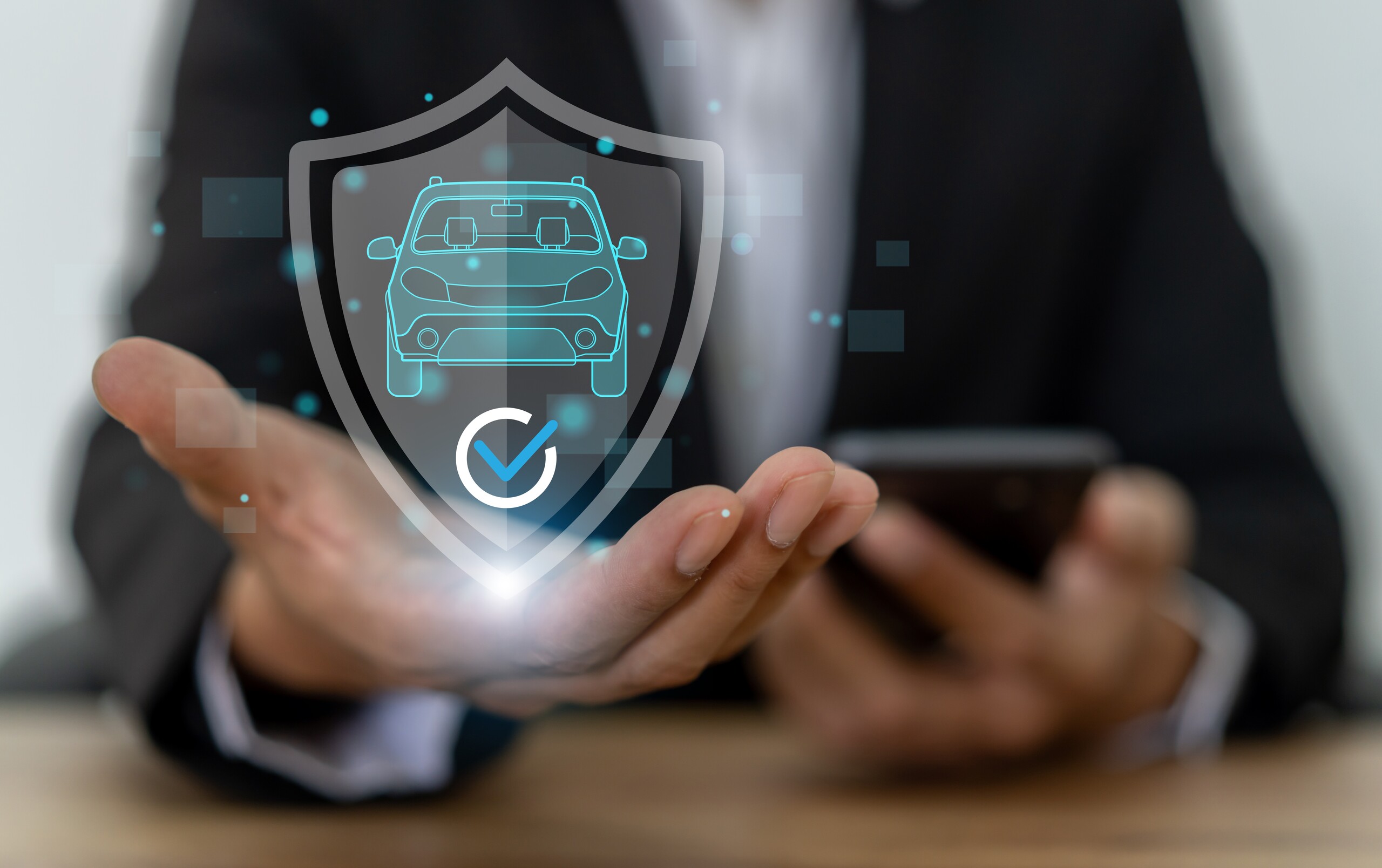 A professional holding a digital car insurance shield graphic shows key legal protections on what to do after a car accident in Tulsa.